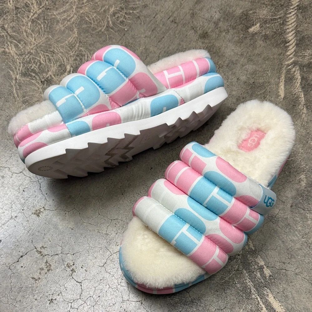* UGG Maxi Pride Slide sandals in a pink and blue graphic print.